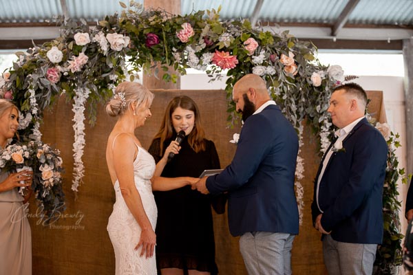 Couple exchanging vows & rings