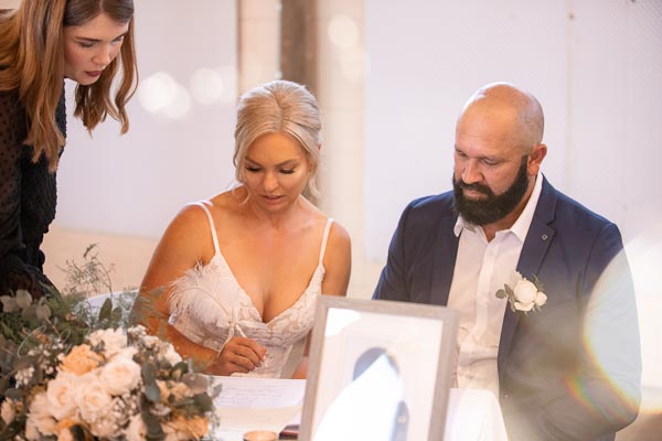 Bride & groom signing registry