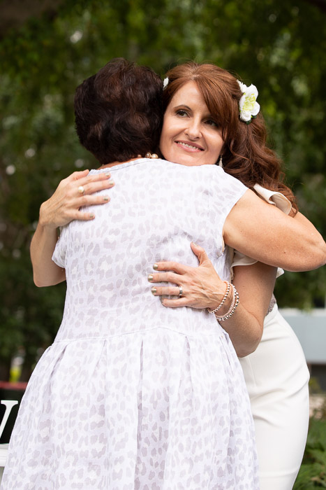 Bride hugging mum