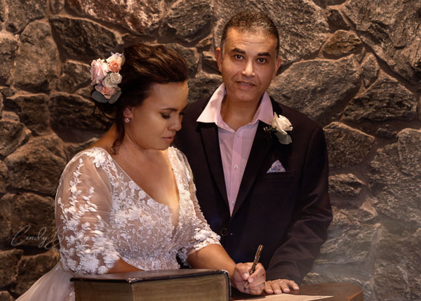 Bride signing wedding registry