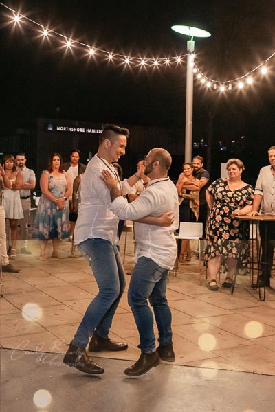 Gay wedding couple first dance
