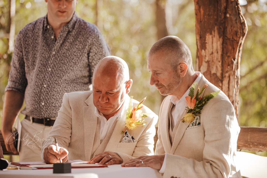 Gay couple signing registry
