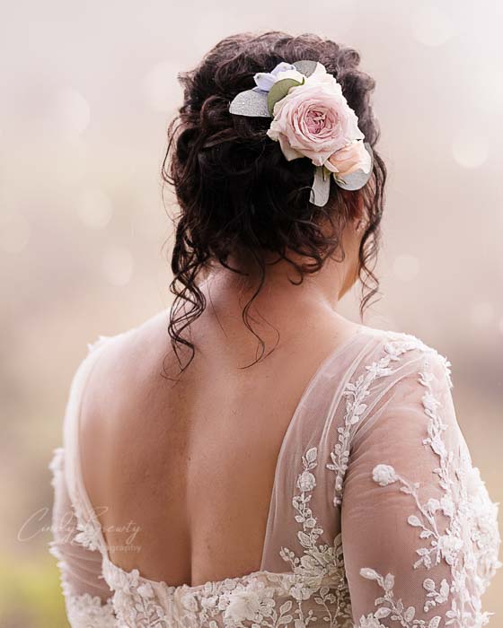 Close of flowers in Bride's hair
