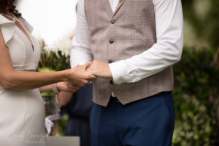 Bride & groom exchanging rings