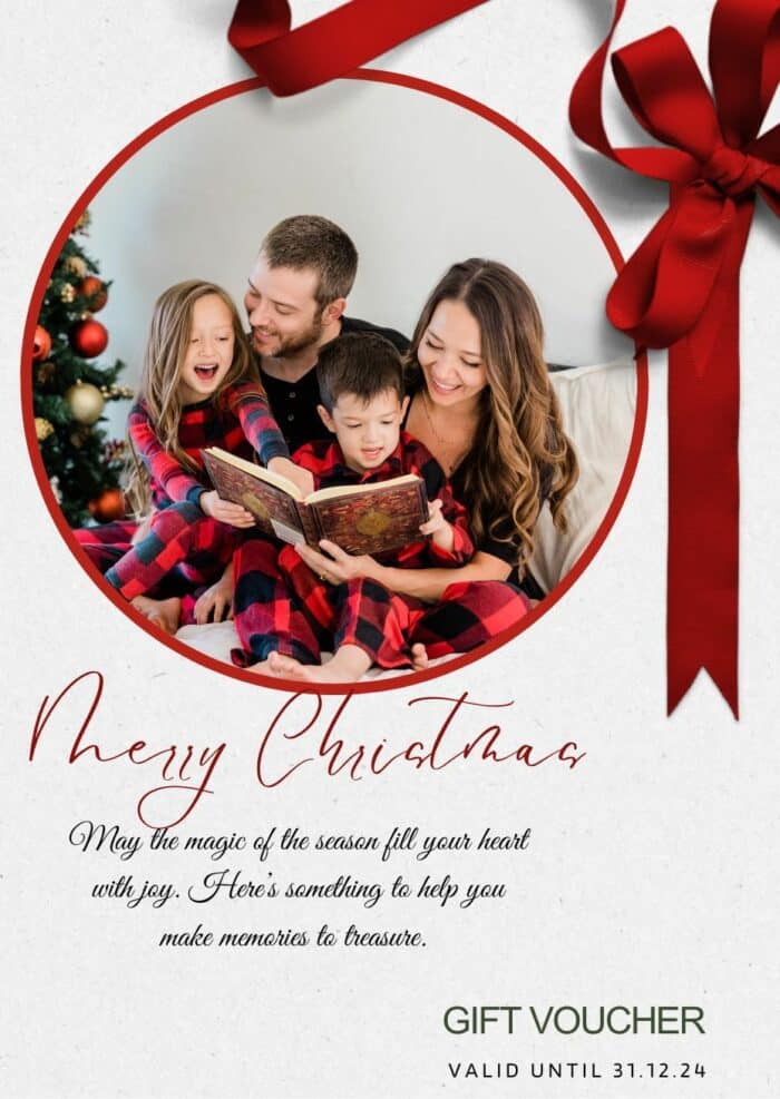 Christmas Gift card showing photo of family in front of Christmas tree